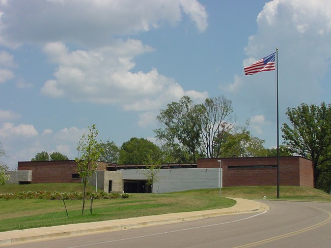 Exterior of the Corinth Civil War Interpretive Center with an American flag on the grounds